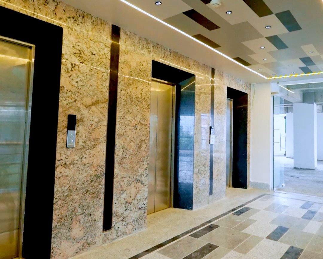 Granite-clad elevator lobby at Prasiddhi Towers